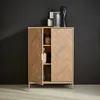 A wooden cabinet with two doors, one slightly ajar, revealing shelves with decorative items. The cabinet is placed against a dark wall. Produktbild-Vorschau