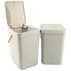 Two light-colored plastic trash cans are shown against a white background. The can on the left has its lid open, revealing the interior. The can on the right has its lid closed. Produktbild-Vorschau