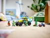A LEGO City all-terrain ambulance and figures are displayed on a wooden floor, with a blurred background of a room. Produktbild-Vorschau