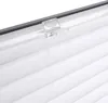 A close-up view of a white pleated blind with a clear plastic clip attached to the top. Produktbild-Vorschau