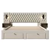 A beige upholstered bed frame with a tufted headboard, two built-in bedside tables with lamps, and four drawers underneath. Podgląd zdjęcia produktu