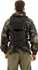 A person wearing a camouflage jacket and cargo pants, with a black backpack on their back. Náhled obrázku produktu