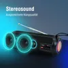 A black portable Bluetooth speaker with glowing blue accents around the speakers and a glowing orange light on the side. Text overlays highlight features. Produktbild-Vorschau