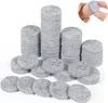 Stacks of round grey felt pads, also known as furniture sliders or felt gliders, are displayed on a white background. In the top right corner, a close-up shows a finger holding one of these felt pads against a wooden surface. Produktbild-Vorschau