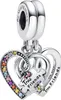 A silver charm with two interlocking hearts and puzzle pieces, adorned with colorful stones. Anteprima dell’immagine prodotto