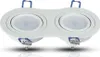 A white, double-headed LED spotlight fixture with blue spring clips, shown against a white background. Voir les images du produit