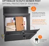 A dark gray mailbox filled with letters and envelopes, with its front door open and keys inserted. Produktbild-Vorschau