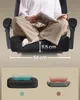 A person sitting on a black gaming chair, with dimensions of the seat indicated. Below, two diagrams illustrate the seat cushion's support. Produktbild-Vorschau