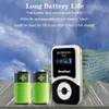 A product shot featuring a Retekess T131 receiver, two large green batteries, and a stack of smaller batteries against a background with a clock face and sky. Produktbild-Vorschau