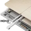 A close-up view of an open desk drawer showing various stationery items. Produktbild-Vorschau