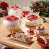 A Christmas-themed table setting with ceramic serving dishes and decorations. Náhled obrázku produktu