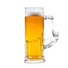 A beer mug with a unique handle shaped like a muscular arm, filled with beer and foam, isolated on a white background. Produktbild-Vorschau