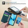 A person is using a phone case with card slots to make a payment at a card machine. Another card is held in hand. Produktbild-Vorschau