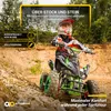 A child is riding a green quad bike on a dirt track with rocks and trees in the background. Produktbild-Vorschau