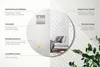 A round mirror is shown with various features highlighted by text overlays. The mirror reflects a modern living room scene with a sofa and blanket. Produktbild-Vorschau