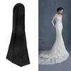 A black garment bag next to a wedding dress worn by a model. Produktbild-Vorschau