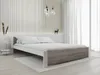 A modern bedroom with a bed, bedside table, and decorative elements. Náhled obrázku produktu
