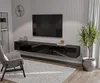 A modern living room setup with a wall-mounted TV and entertainment unit. Produktbild-Vorschau
