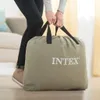 A person is holding a large duffel bag with the Intex logo on it. Náhled obrázku produktu