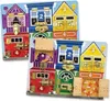A close-up, slightly angled view of two Melissa & Doug wooden activity boards, each designed as a row of houses with various locks and latches. Produktbild-Vorschau