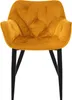 A single mustard yellow velvet dining chair with black legs, shown from the front against a white background. Náhled obrázku produktu