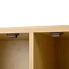 Close-up view of magnetic catches inside two compartments of a wooden cabinet. Voir les images du produit