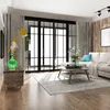 A living room scene with an aroma diffuser on a wooden cabinet, a lamp, a sofa, and a coffee table. Voir les images du produit