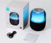 A product shot of a Bluetooth speaker and its packaging, along with accessories. Náhled obrázku produktu