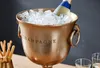 A champagne cooler filled with ice and a bottle of champagne. Produktbild-Vorschau