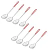 A collection of eight stainless steel skimmers with red handles arranged diagonally on a white background. Produktbild-Vorschau