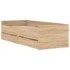 A wooden bed frame with drawers against a white background. Voir les images du produit