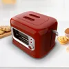 A red retro-style toaster sits on a white surface with cookies and a muffin nearby. Voir les images du produit
