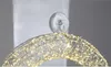 A close-up view of a decorative LED wreath with warm white lights, attached to a wall with a clear suction cup hook. Produktbild-Vorschau