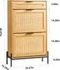 A wooden shoe cabinet with rattan inserts and black metal legs, shown with dimensions indicated by text and lines. Podgląd zdjęcia produktu