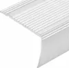 A close-up of a silver L-shaped aluminum stair nosing profile with ribbed texture. Produktbild-Vorschau