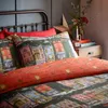 A cozy bedroom scene with Christmas-themed bedding. Anteprima dell’immagine prodotto