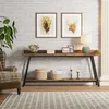 A console table with decorative items and baskets in a living room setting. Anteprima dell’immagine prodotto