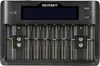 A black battery charger with multiple slots and a digital display. Produktbild-Vorschau