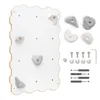 A climbing wall for children with attached grips and a set of additional grips and mounting hardware. Anteprima dell’immagine prodotto