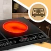 A close-up view of a black induction cooktop with a glowing red heating element, set against a blurred kitchen background and a graphic overlay. Voir les images du produit