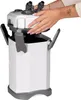 A person's hands are shown assembling a white and gray aquarium external filter. Podgląd zdjęcia produktu