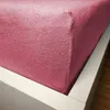 Close-up of a pink fitted sheet on a bed. Náhled obrázku produktu