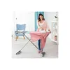 A woman is ironing a pink shirt on an ironing board in a room. Produktbild-Vorschau
