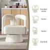 A fluffy beige armchair is shown in a room with a cabinet in the background. To the right, there are four smaller images of the chair from different angles, with German text labels. Anteprima dell’immagine prodotto