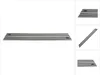 A long, flat metal guide rail with black stripes and yellow labels, presented on a white background. Produktbild-Vorschau