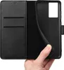A hand holding a black phone case with a wallet flap. Produktbild-Vorschau
