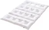 A white quilted mattress topper or duvet is shown from a diagonal angle against a white background. Produktbild-Vorschau