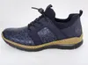 A side view of a blue sneaker. Voir les images du produit