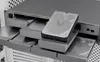 A close-up shot of a hard drive being inserted into a server rack. Produktbild-Vorschau