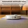 A white robot vacuum cleaner is shown on a carpet with text overlays. Behind it, a wooden cabinet and part of a couch are visible. Náhľad obrázku produktu